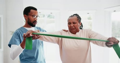Physiotherapy, arms and resistance with a black woman in a clinic for rehabilitation
