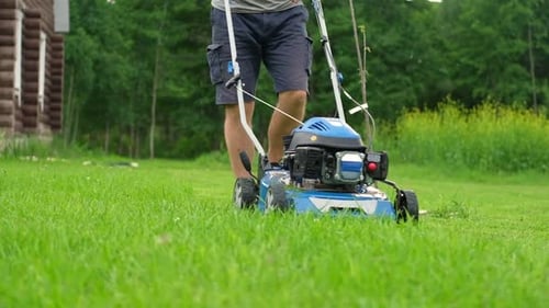 Lawn Mower Cutting Grass Small Grass Cuttings Fly Out of Lawnmower Grass Clippings Get Spewed Out of