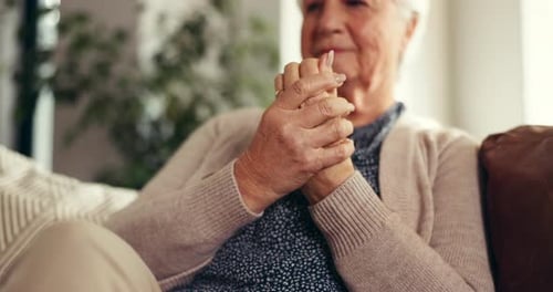 Senior woman, hands and pain with arthritis for joint inflammation or wrist injury on sofa in home
