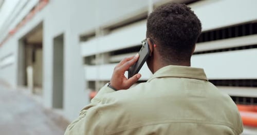 Business man, phone call and back in street with conversation, listening