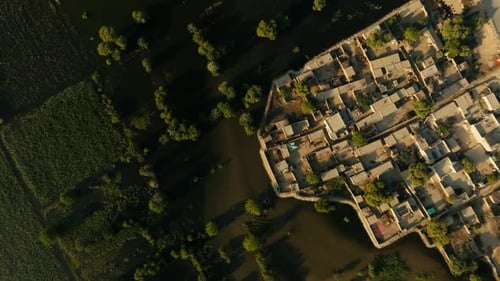 Aerial top view of green fields and forest all destructed by heavy flood in Punjab, Pakistan.