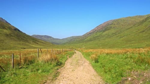 4K Picturesque landscape hiking trail through the Scottish Highlands on a sunny summer day, Scotland