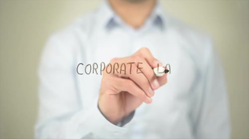Corporate Law, Man Writing on Transparent Screen
