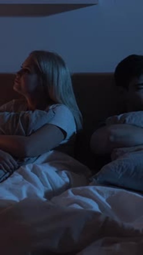 Offended Couple Relationship Issue in Bed Vertical