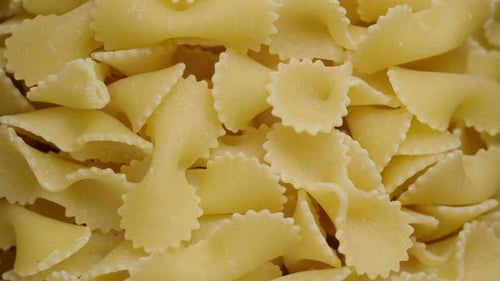 pasta farfalle close-up, rotation in the jar.