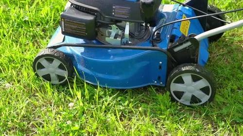 Lawn Mower Cutting Grass Small Grass Cuttings Fly Out of Lawnmower Grass Clippings Get Spewed Out of