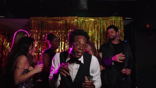 Friends Enjoying Party Dancing and Drinking in Slow Motion