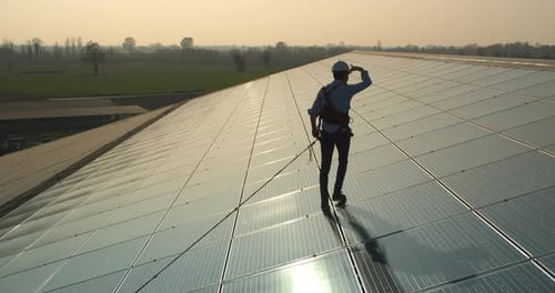 Aerial shot of maintenance assistance technical worker in uniform is smiling satisfied of his work