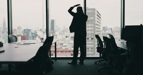 Phone call, stress and man at window in office with anxiety debt and bankruptcy in city in Japan