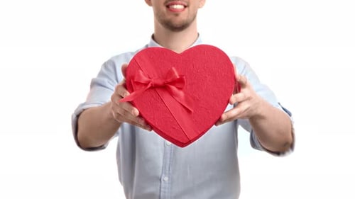 Unrecognizable Man Giving Present Gift Box Heart Shape Valentine's Day Holiday Celebration Isolated