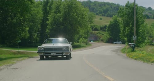Old vintage car on a country road