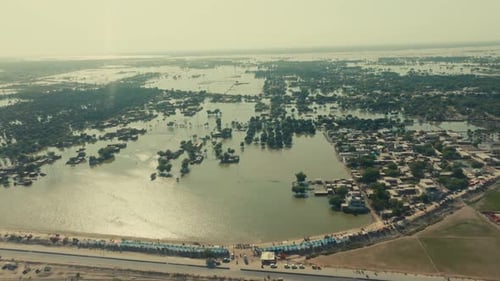High altitude aerial glide towards flooded Jalalpur Pirwala, Pakistan