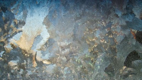 Light Plays in a Frosty Pattern on the Glass