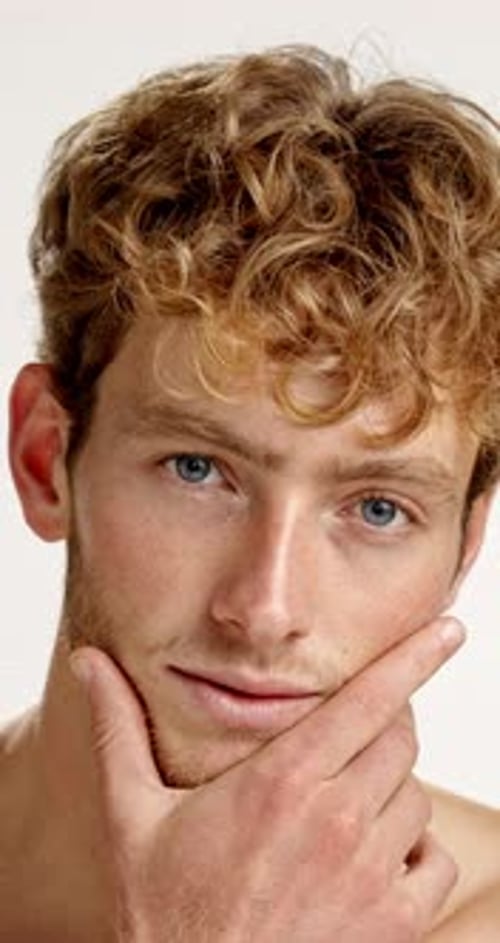 Skincare, confident and face of man in studio with health, wellness and facial grooming