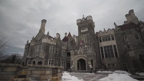main entrance with fountain of Casa Loma castle style mansion and garden in midtown Toronto during w