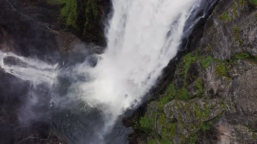 Voringfossen Waterfall and Sorrounding Valley in Rainy and Fogy Typical Norway Weather Captured By