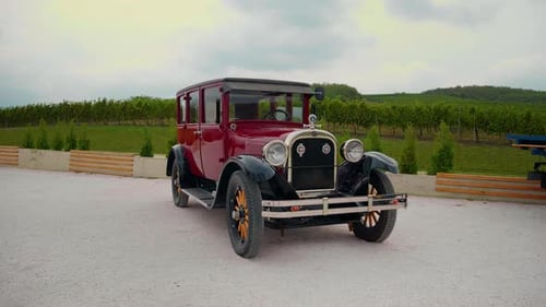 Vintage exhibition automobile set on display.