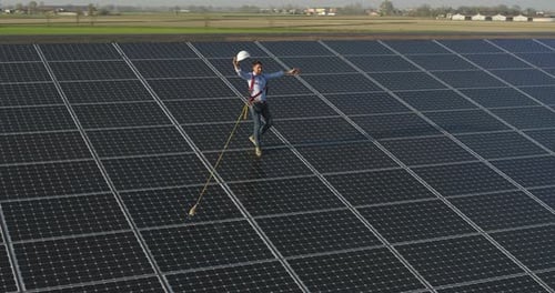 Aerial shot of maintenance assistance technical worker in uniform is smiling satisfied of his work