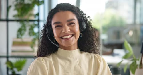 Happy woman, face and call center with headset for helpdesk or customer service at office