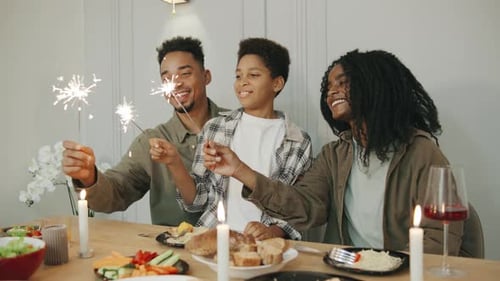 A Joyful Family Comes Together to Celebrate Christmas or New Year with Festive Dinner Joyfully