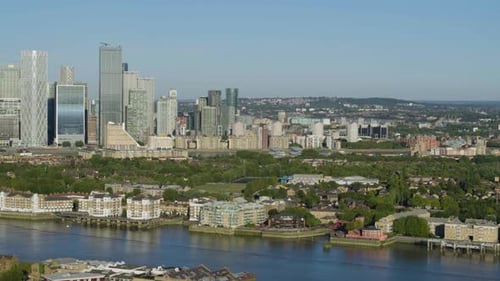 Panning aerial establishing shot overlooking the Rotherhithe residential district and the historic C
