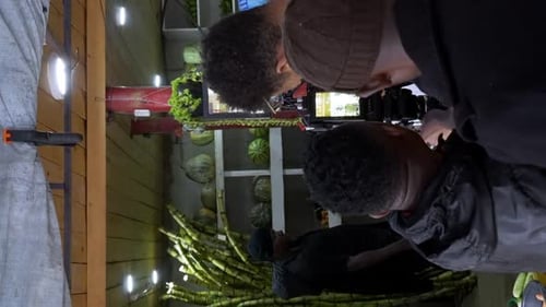 Setting Up the Camera for a Commercial Video Shoot by the Film Crew - Vertical Shot