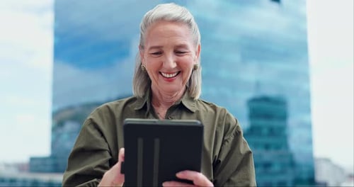 Business, tablet and senior woman in city for social networking, online website and connection