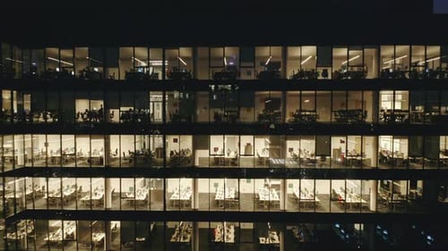 DroneCaptured LateNight Corporate Work in a Glass Skyscraper