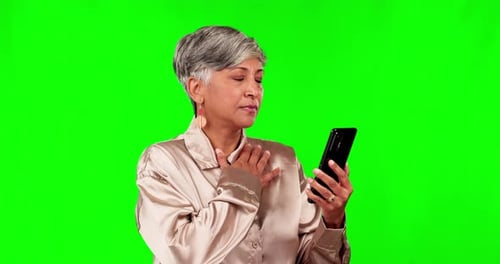Phone, reading and bad news with a woman on a green screen background in studio thinking