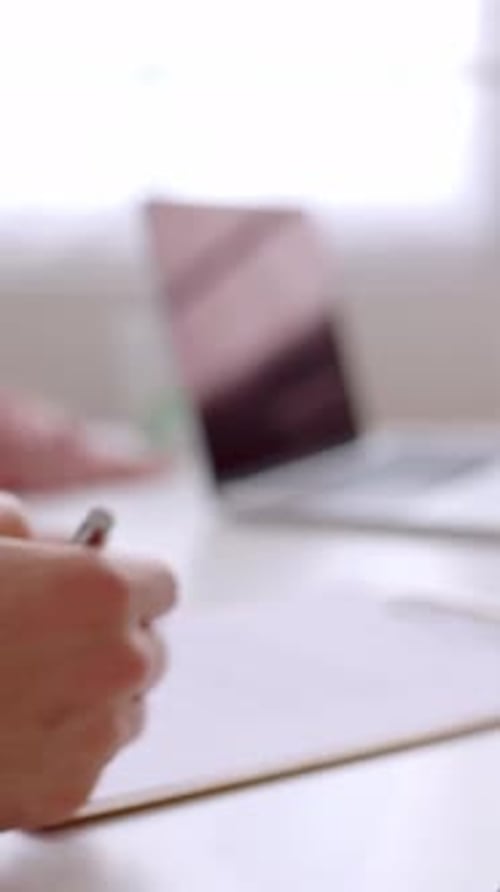 Close Up View of Young Couple Signing Contract After Buying First Property