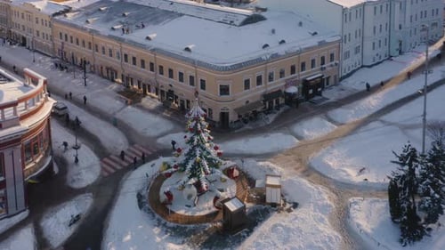 Aerial Top View Carousel on the Snowy City Square