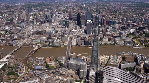 London City Aerial View of the Shard, River Thames and the City, panning round to show City Hall and