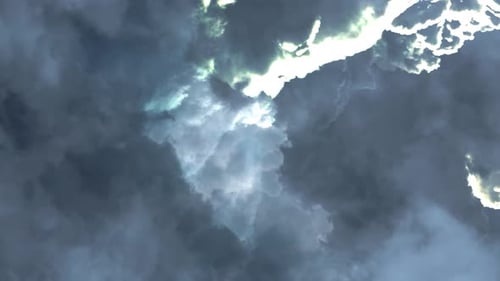 a thunderstorm inside the thick clouds in the sky that was moving closer.