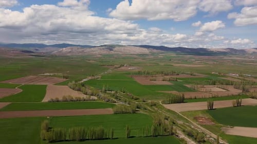 Aerial view of wide plain farmland 4K