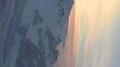 Vertical Video of a Magical Winter Sunset Over a Foggy Mountain at Botev Peak Bulgaria