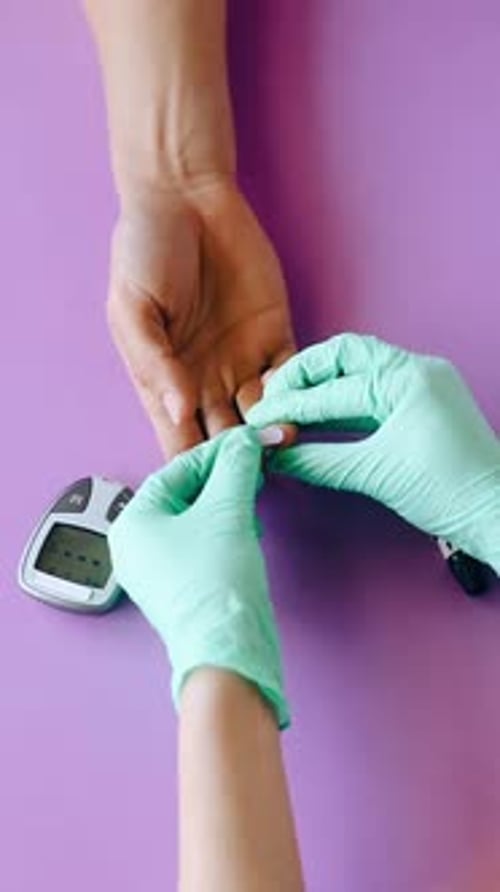 Doctor Performing Diabetes Tests