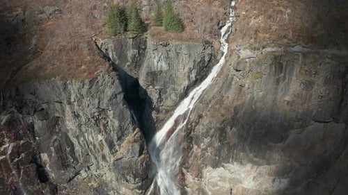 A famous Voringfossen waterfall in Norway. Streams of turbulent whitewater falling down from the jag