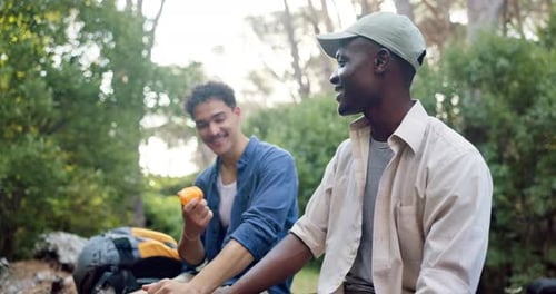Hiking, friends and men in nature with fruit for bonding, relax and conversation outdoors
