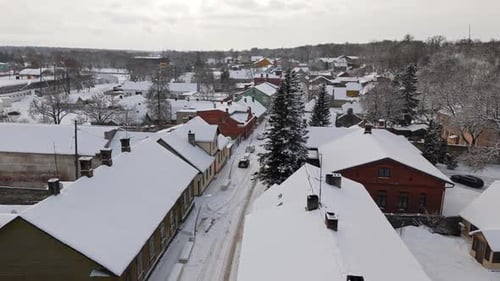 Aerial view over snowy suburban streets, winter day in Rakvere, Estonia
