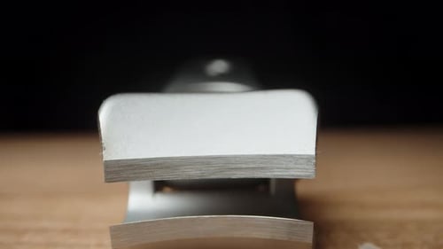 fingernail clipper on a black background. The remains of clipped nails are nearby. Dolly slider, ext