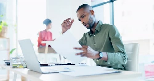 Bankruptcy, stress or black man with anxiety, documents problems, finance trouble