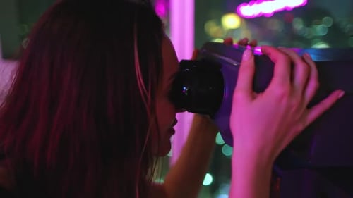 Woman Look on Night City Cityscape in Telescope