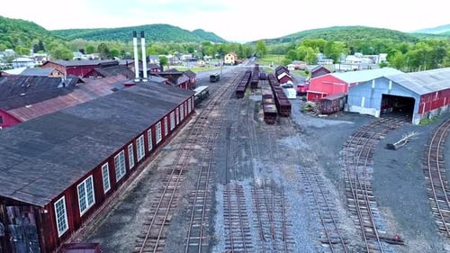 An Aerial View of an Abandoned Narrow Gauge Coal Rail Road with Rusting Hoppers and Freight Cars and