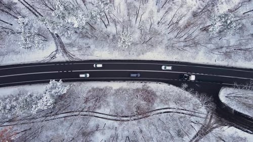 Aerial Top View From Drone Lot of Vehicle Driving on Snowy Ice Asphalt Road Exploring Local