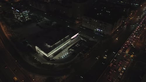 Bright Illumination on Building in Night Town in Winter