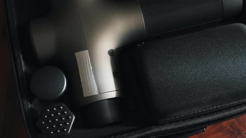 Closeup of Percussion Massager with Various Nozzle Therapy for Joint Pain Relief and Physiotherapy