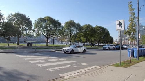 Vancouver, Canada - A Pedestrian Lane Being Traversed by a White Vehicle - Wide Shot
