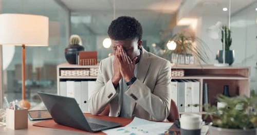 Stress, office and business black man on laptop with mistake, financial crisis and bankruptcy