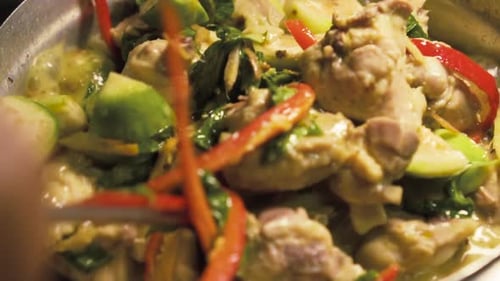 Close up of Sizzling Chicken with Chili and Green Vegetables