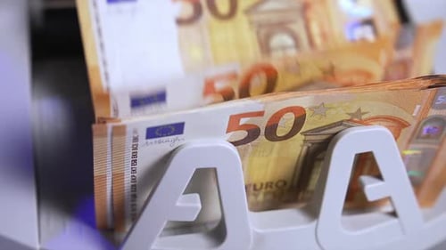 Currency financial banknote counter. Close up of counting money in special machine.